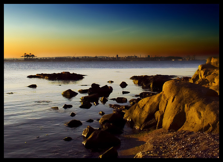 Stone In Focus | town, sky, rocks, shore, sea