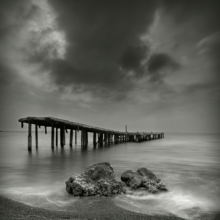 Where light died | wharf, black and white, rocks, sea