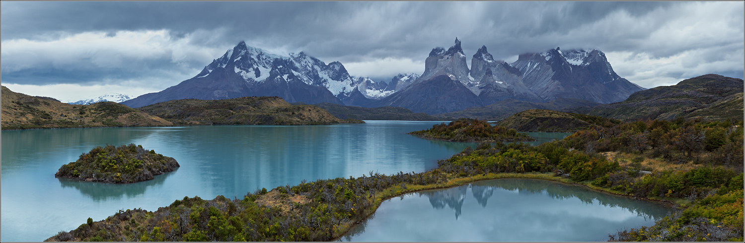 Mountain lake and island | island, mountain lake, snowy peaks, sky