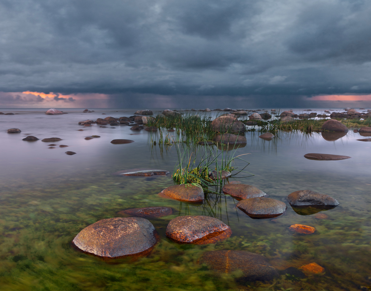 It rains on the horizon | landscape, green, clear, water, stones, sky, rainclouds, dark, rain, horizon