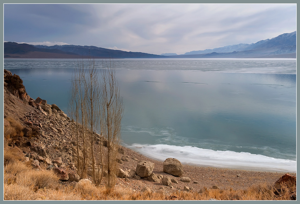 Shore of the big lake | lake, shore, hillside, rocks